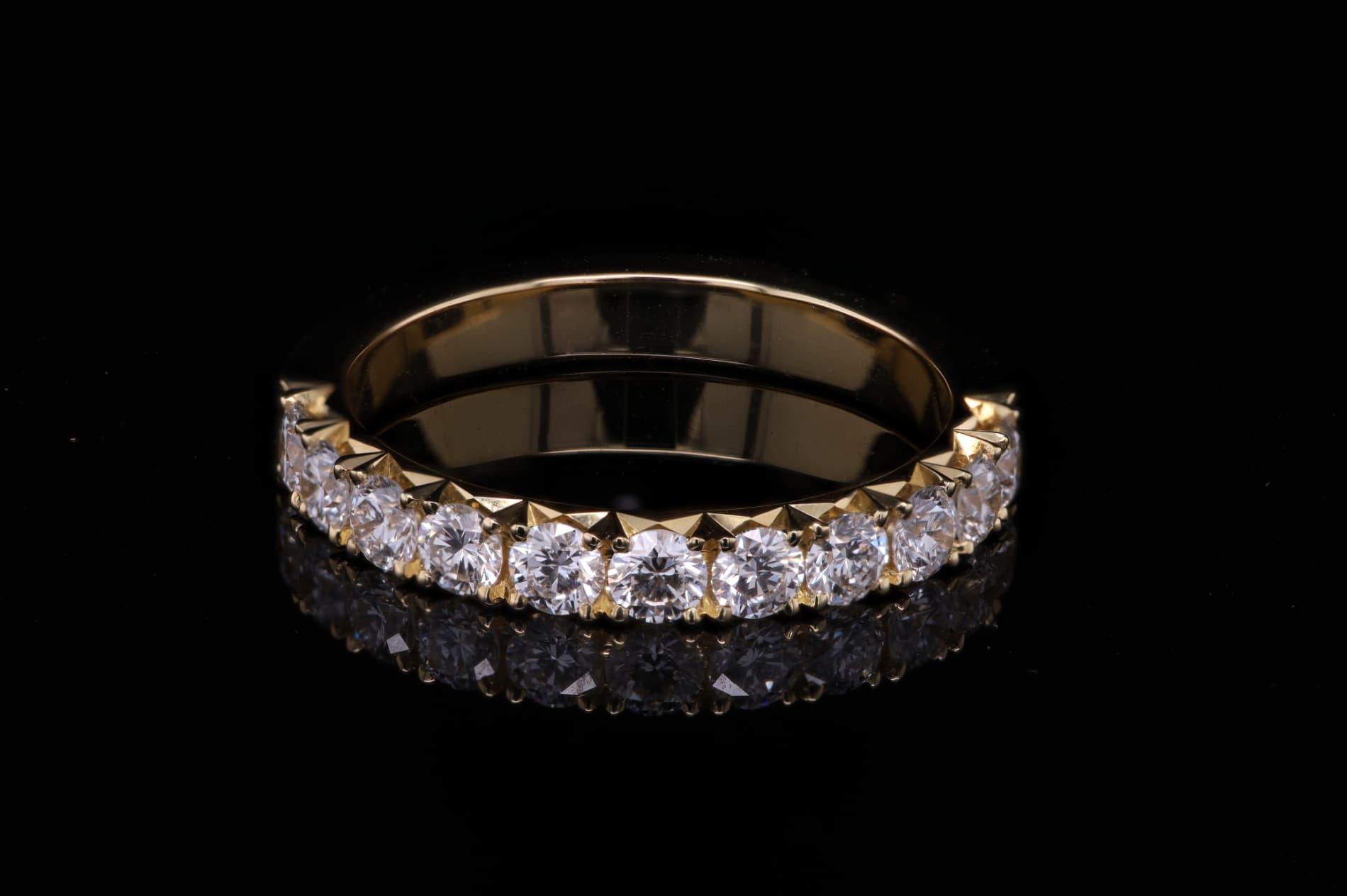 Diamond-set Atelier Barnard jewellery photographed close up.